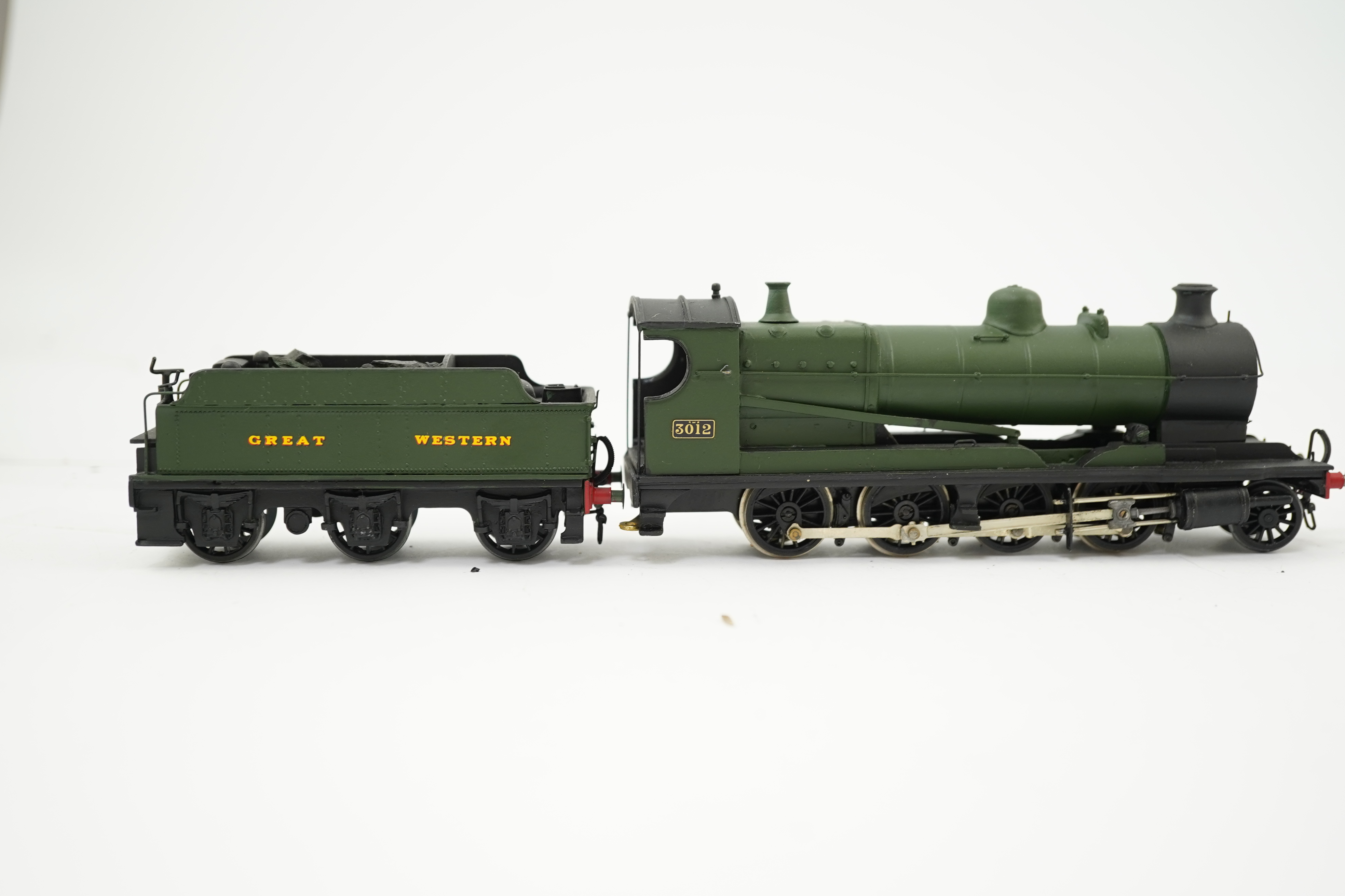 Three 00 gauge brass and white metal kit built GWR tender locomotives; a 2884 class 2-8-0, 2884, together with an 33xx class 4-4-0, 3454, and a War Dept. 2-8-0, 3012, all constructed, painted and lined to a high standard